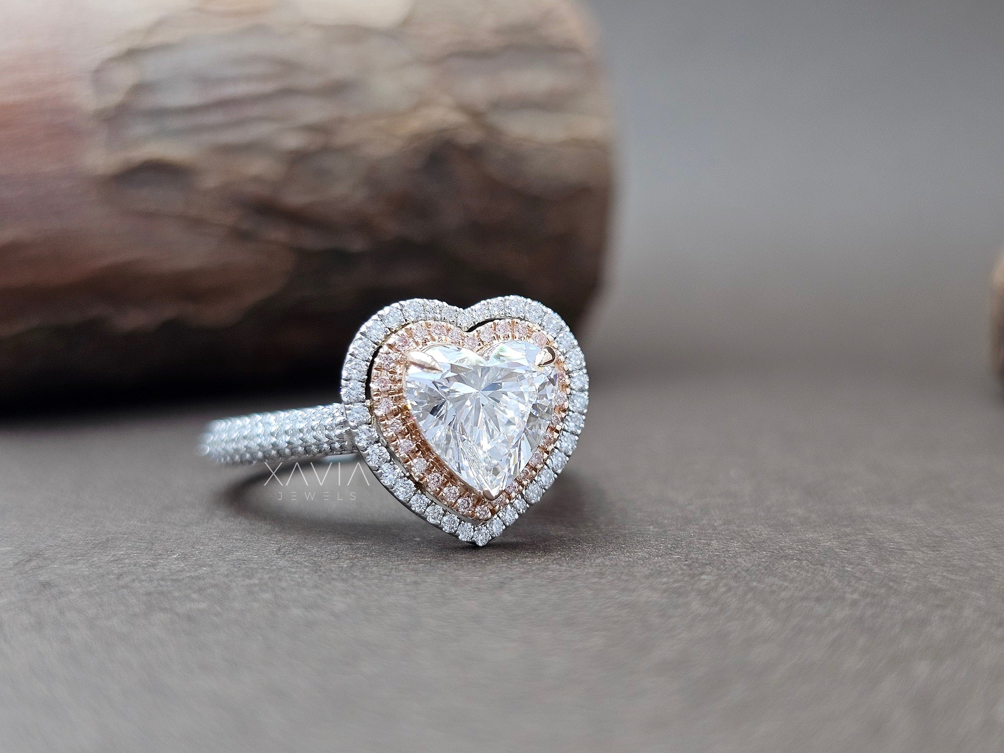 Heart-shaped diamond ring with rose gold and silver accents on a neutral background - Xavia Jewels