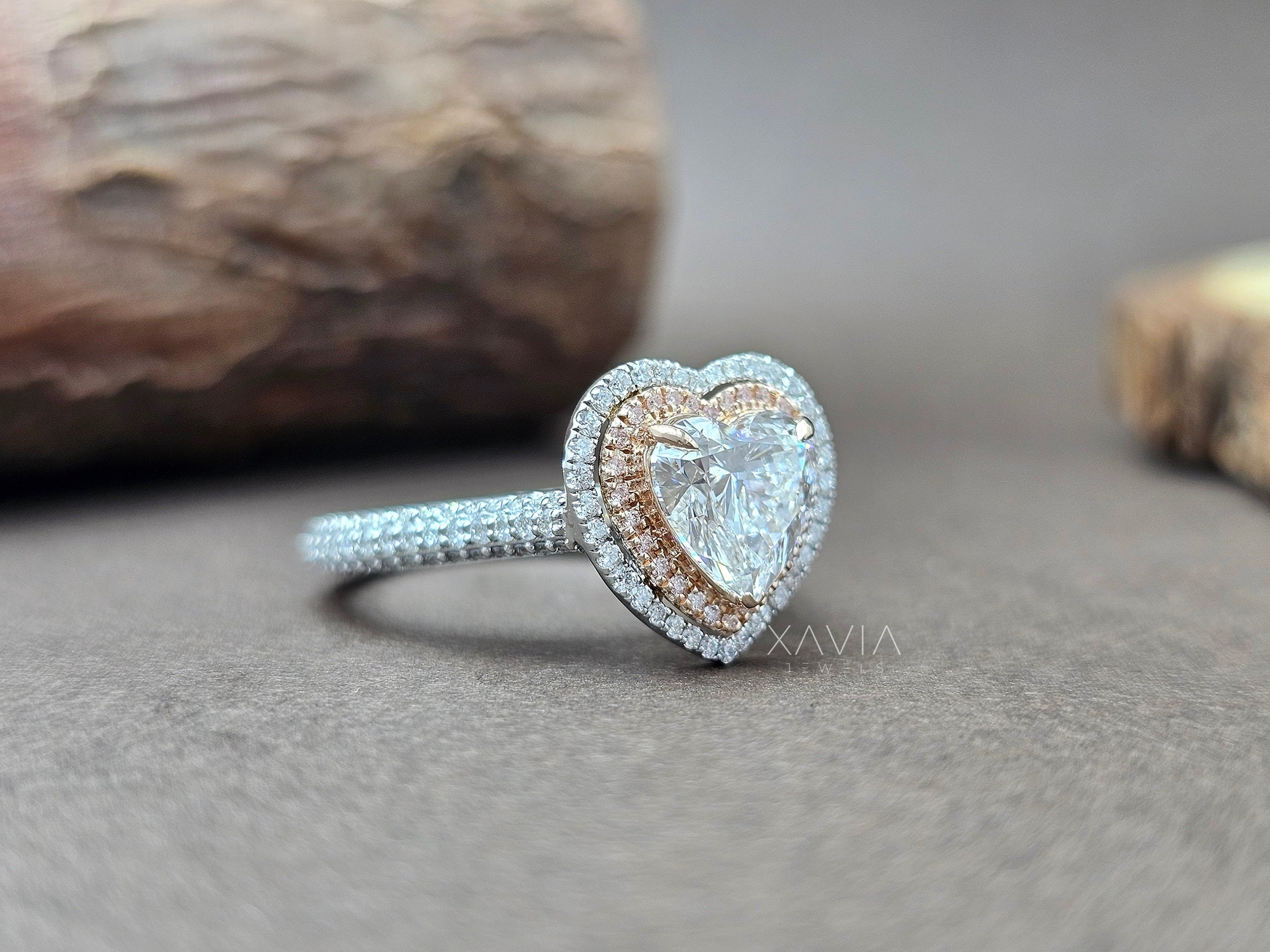 Heart-shaped diamond ring with rose gold and silver accents on a neutral background - Xavia Jewels