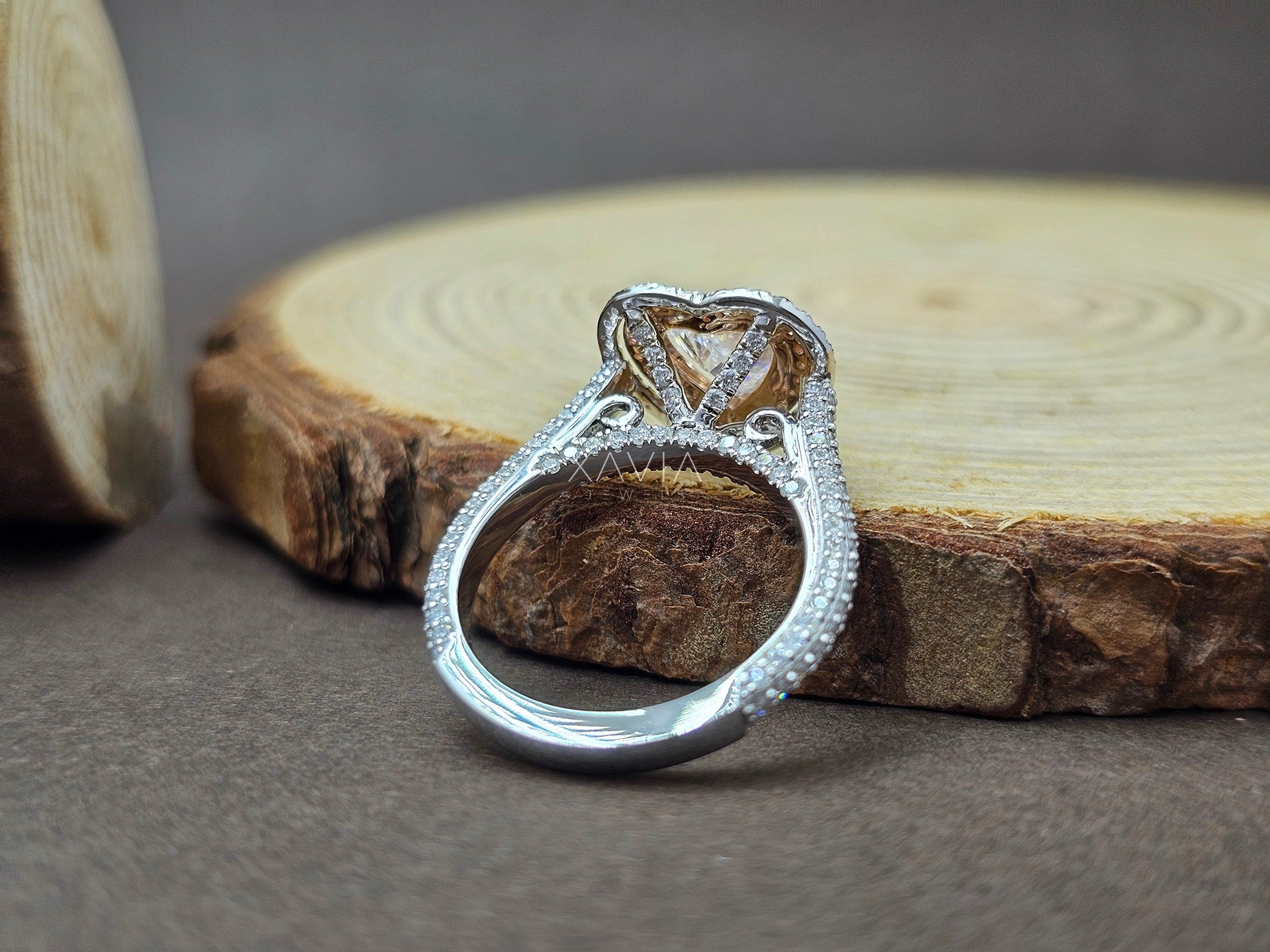 Silver ring with diamond-like stones on a wooden surface - Xavia Jewels