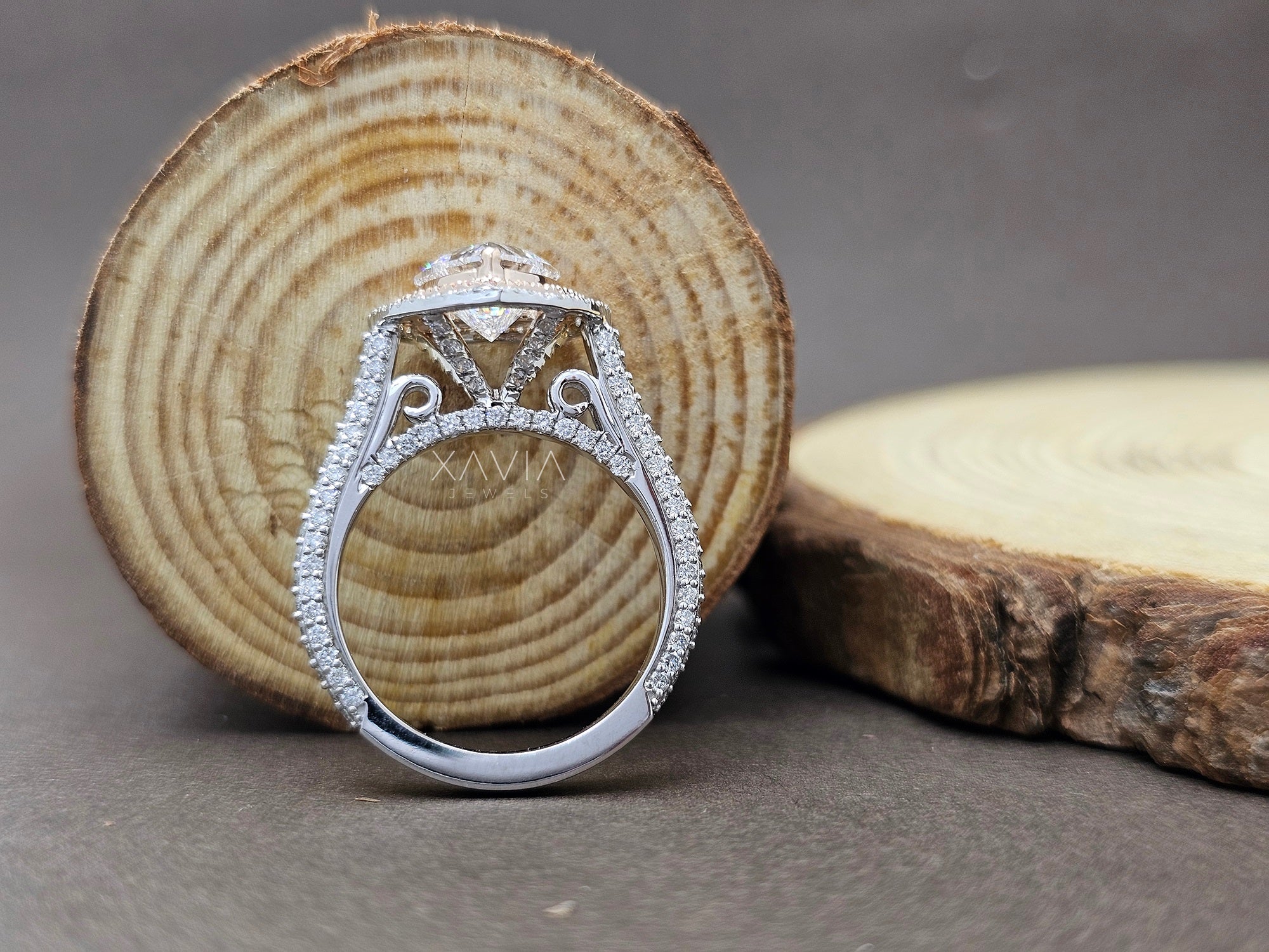 Silver ring with diamond on a wooden surface - Xavia Jewels
