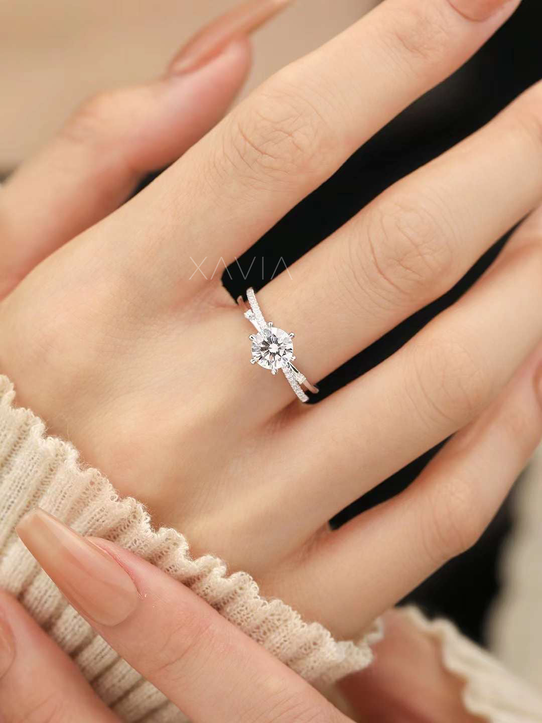 close-up side angle of round brilliant lab diamond engagement ring with pavé split band worn on hand