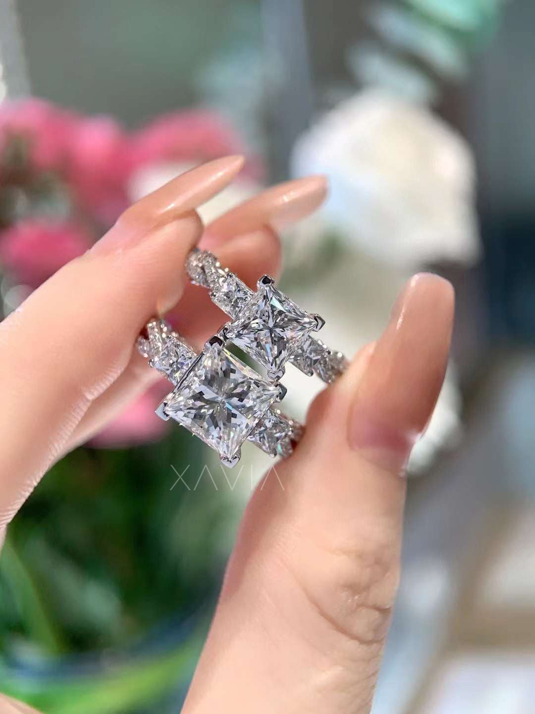 angled view highlighting sparkle of princess cut three-stone lab diamond ring with pavé platinum band
