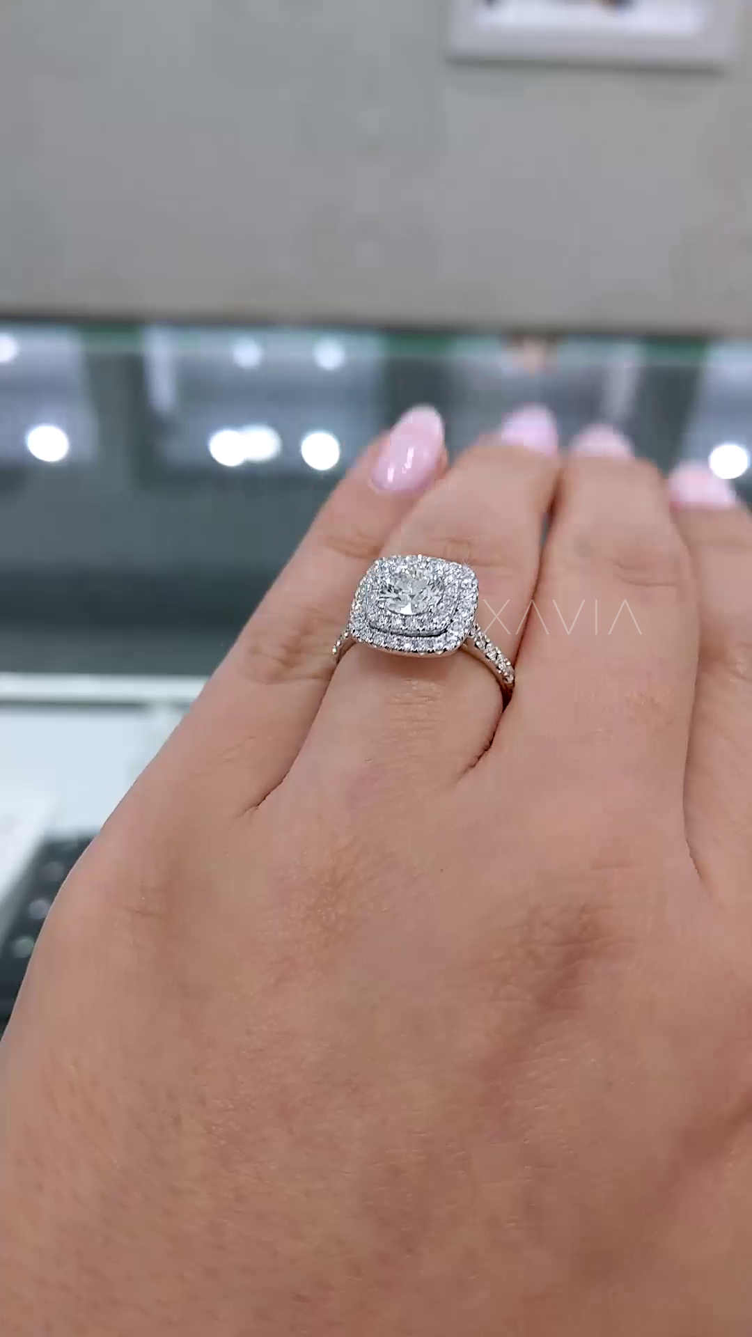 angled perspective of cushion double halo lab grown diamond ring highlighting elevated setting and continuous pavé diamond band detail