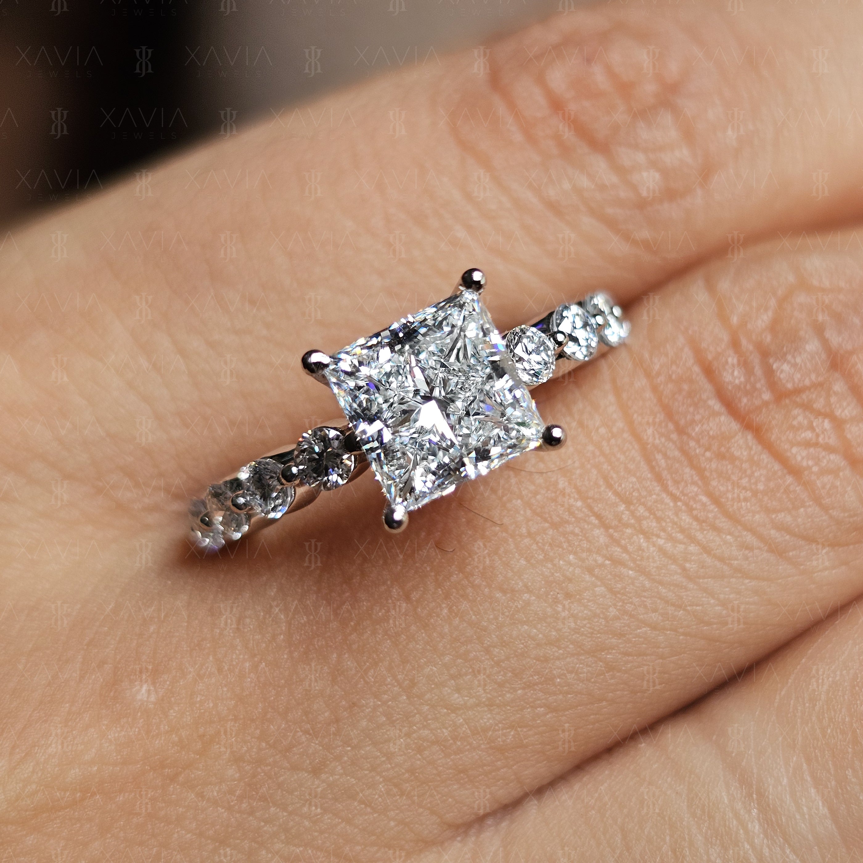 Angled top view of luxury princess cut lab diamond engagement ring featuring elevated basket setting and continuous round diamond eternity band