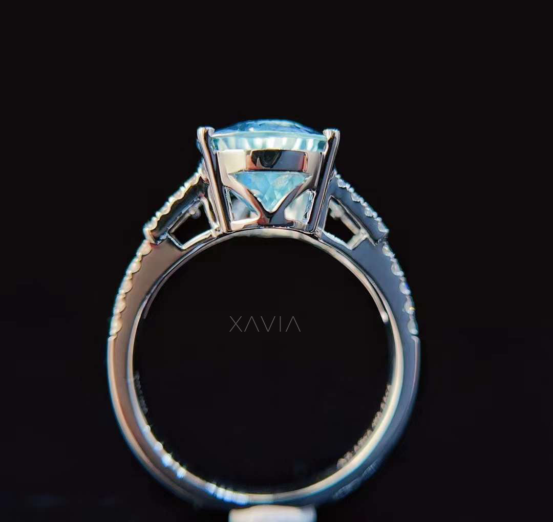 Gallery view of pear aquamarine engagement ring showing elevated basket setting and split shank diamond band structure