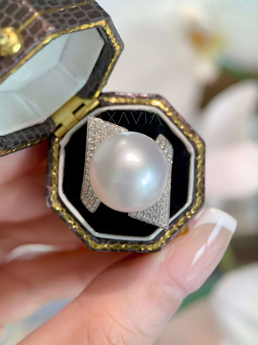 Side angle view of architectural pearl diamond ring showing pavé lab-grown diamonds and sculptural modern setting
