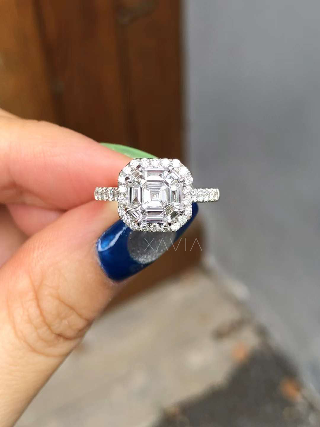 front view of asscher cut lab diamond engagement ring featuring baguette cluster halo and pavé diamond band in white gold setting