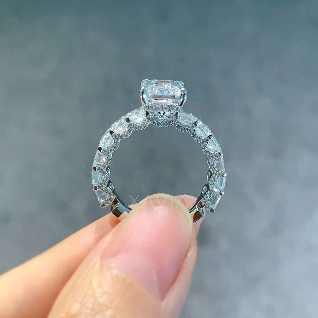 back angle showing emerald cut center and detailed basket setting