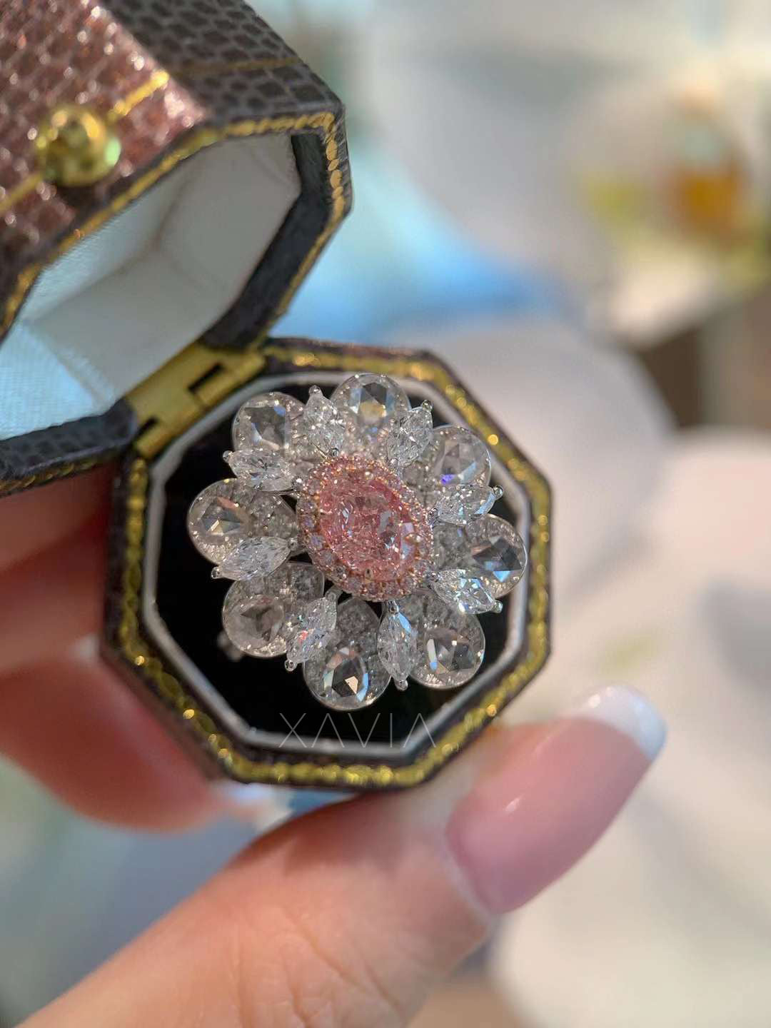 detailed image of blooming pink diamond ring with dual petal-shaped halo