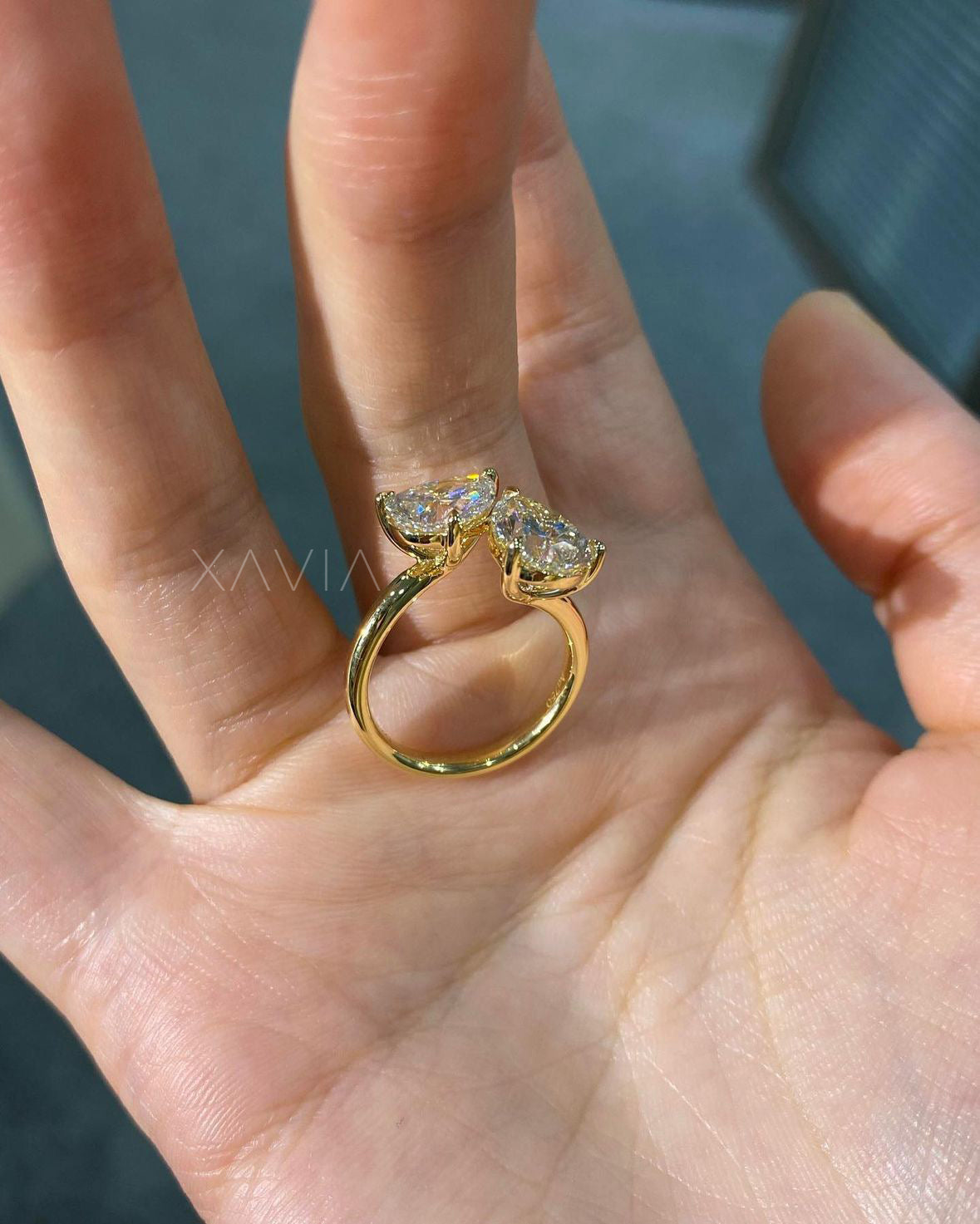 angled side view of two stone diamond ring in open bypass design