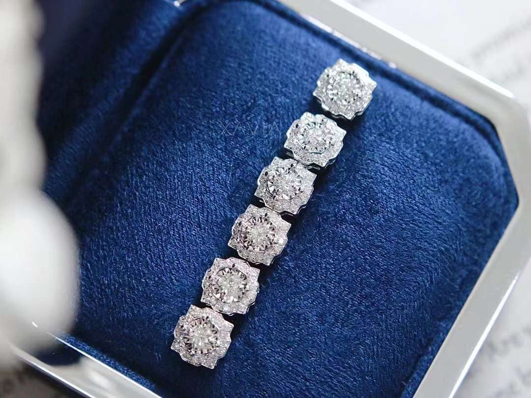 Multiple Art Deco floral stud earrings displayed in row