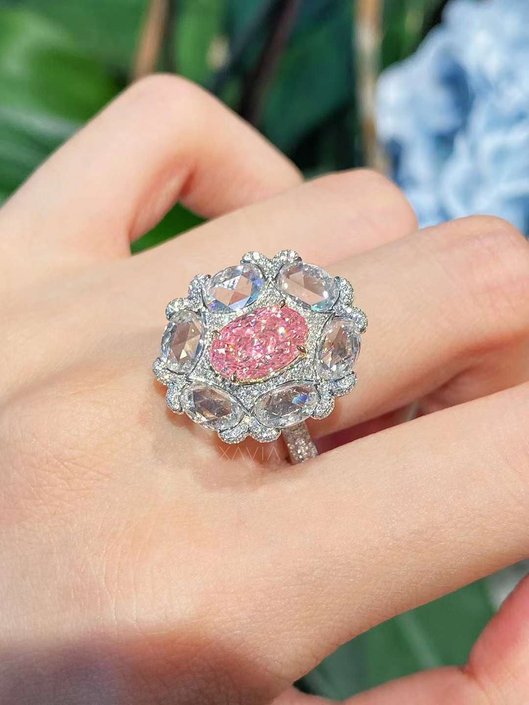 top view of Calyssia pink oval diamond ring featuring floral-inspired rose-cut halo diamonds in pavé luxury setting