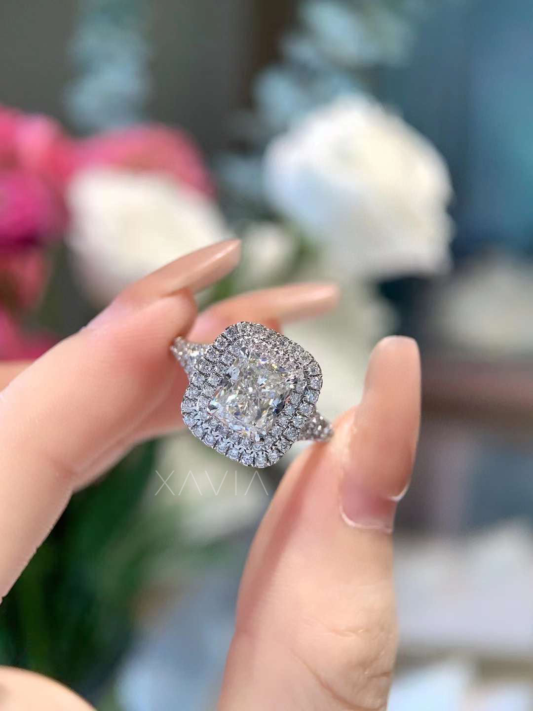 close-up of cushion center lab diamond ring with double halo and intricate pavé detailing