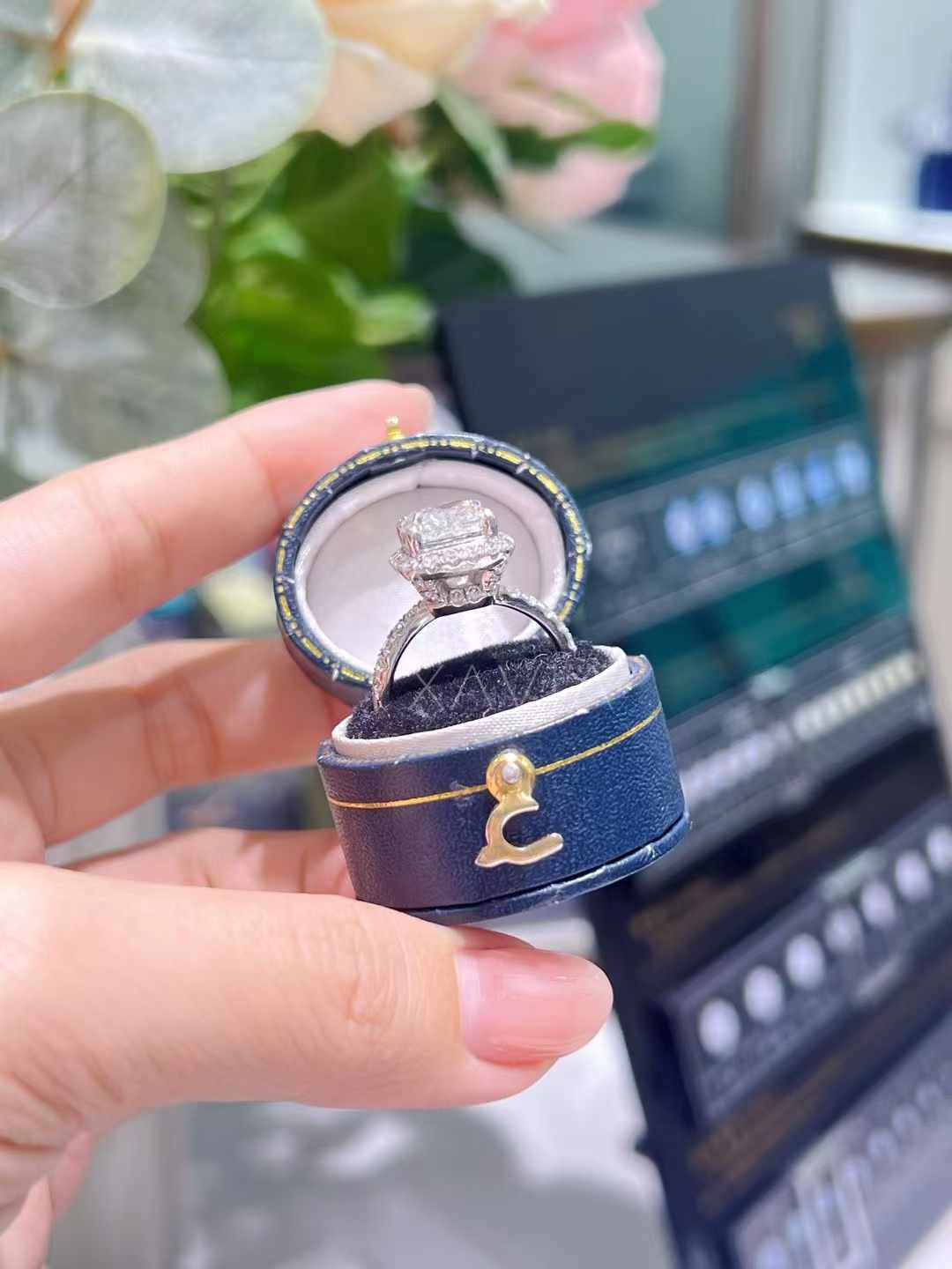 Side profile view of cushion cut lab grown diamond halo engagement ring showing elevated basket setting, pavé diamond band and halo design crafted in white gold