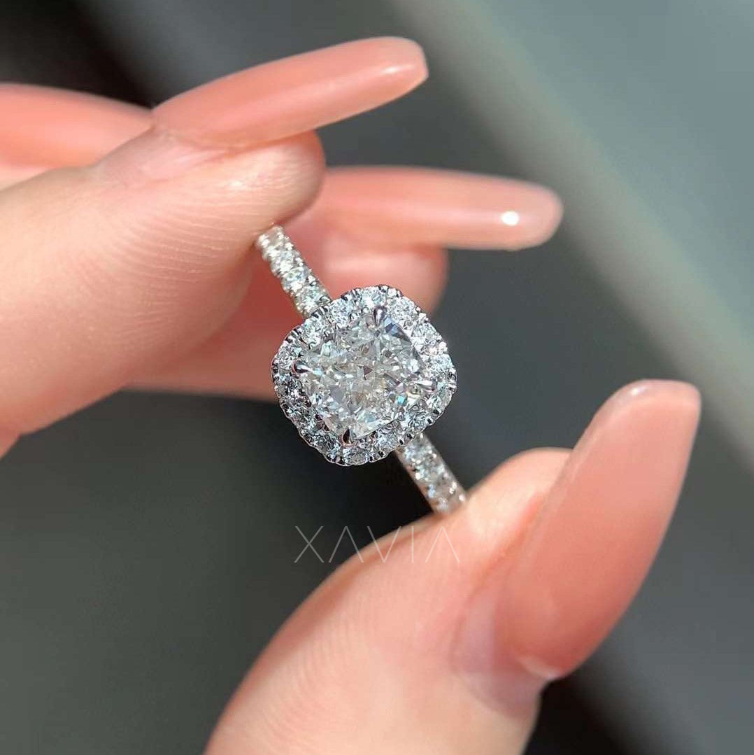 top angle of cushion halo engagement ring with pavé diamond band