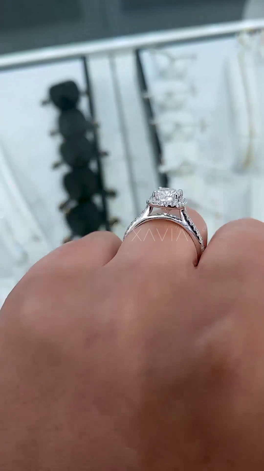 side profile of cushion cut lab diamond halo ring showing elevated basket setting and split shank pavé band structure in white gold finish