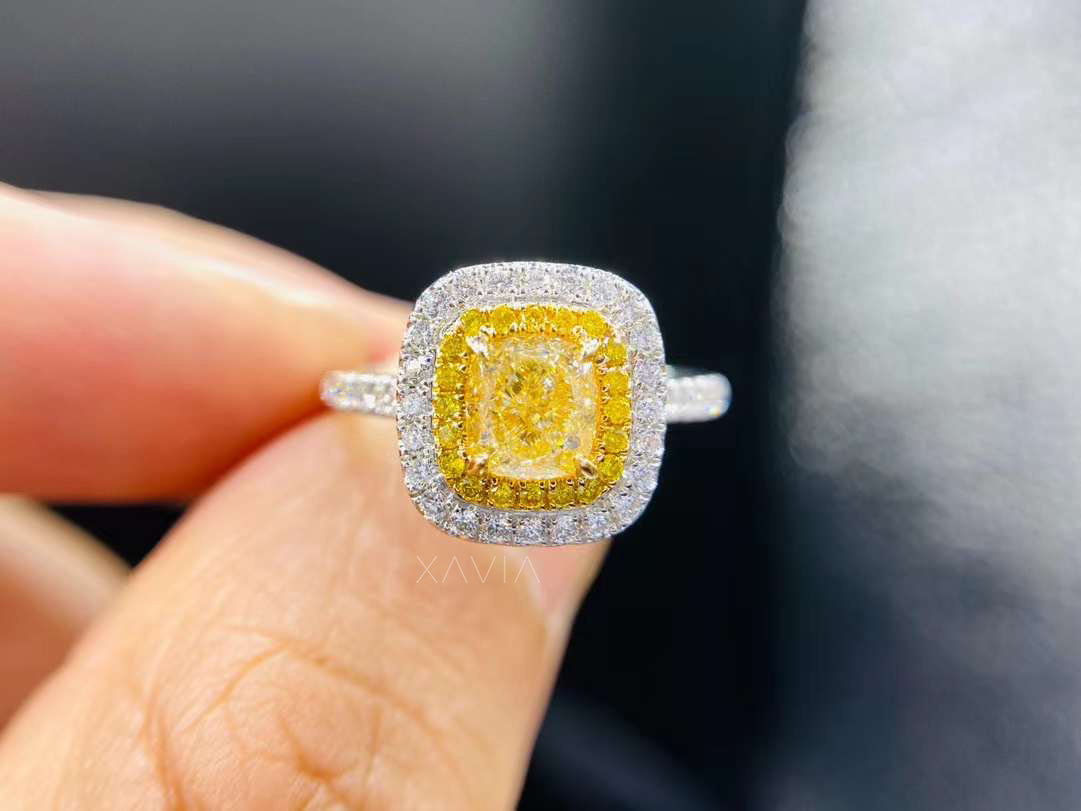 front view of cushion cut fancy yellow lab diamond ring with double halo in yellow and white pavé setting