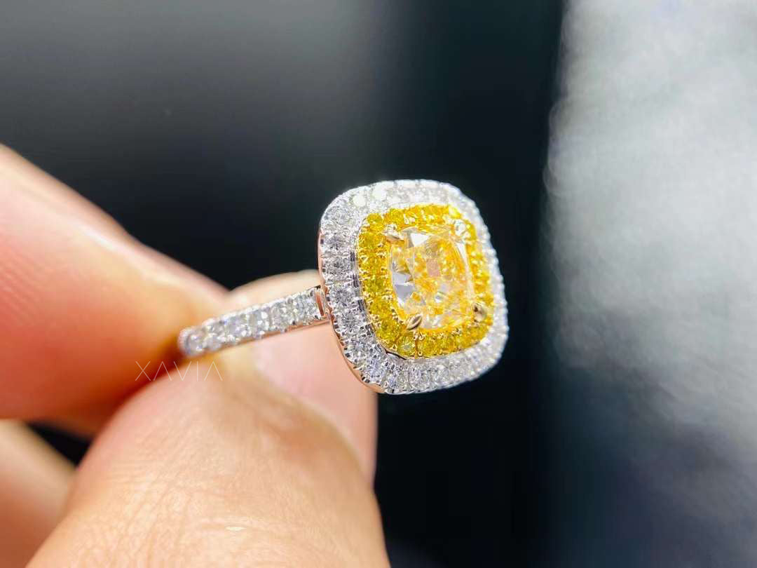 side angle of cushion cut fancy yellow lab diamond engagement ring with double halo and pavé shank in white gold