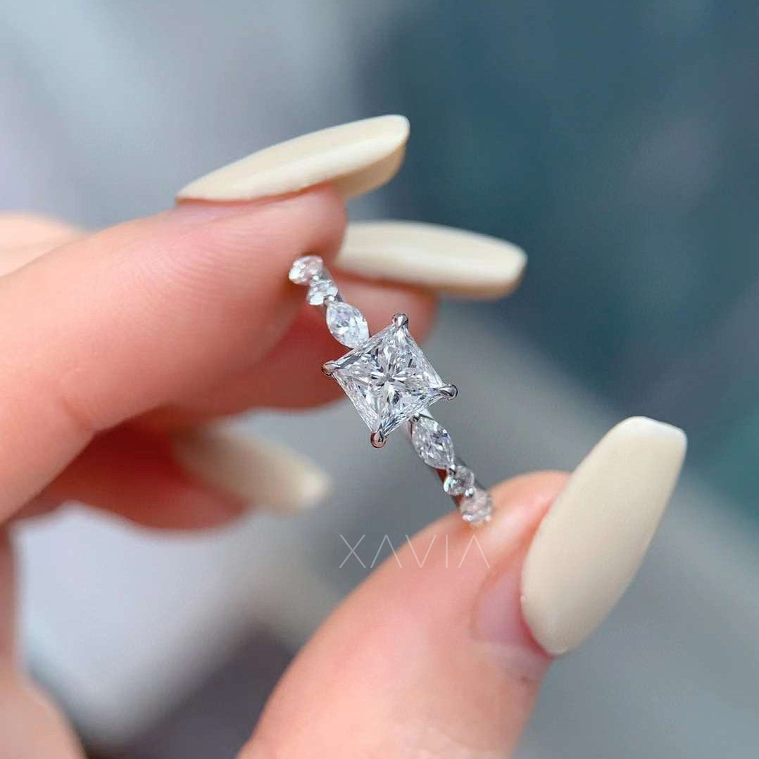 elegant princess cut diamond engagement band held in hand