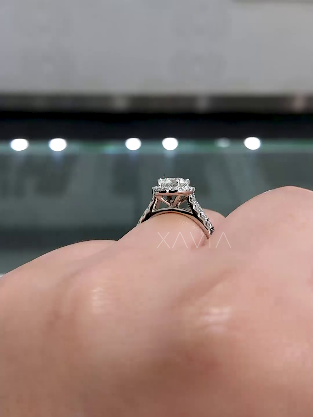 lifted basket setting of halo diamond engagement ring