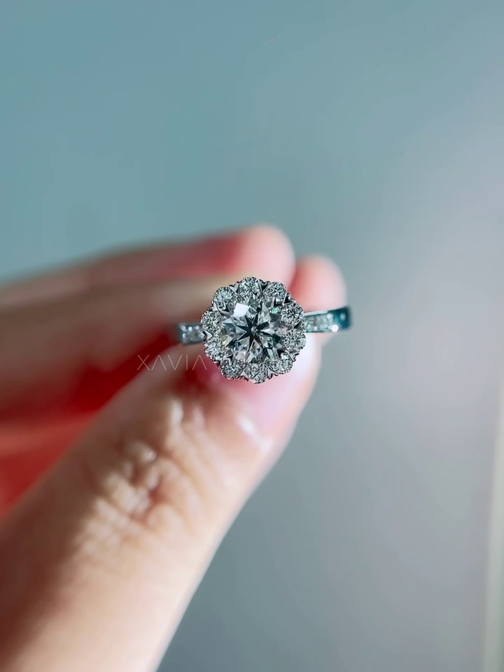 Elegant side angle photograph highlighting the floral halo structure and pavé diamond shoulders of a lab grown diamond engagement ring