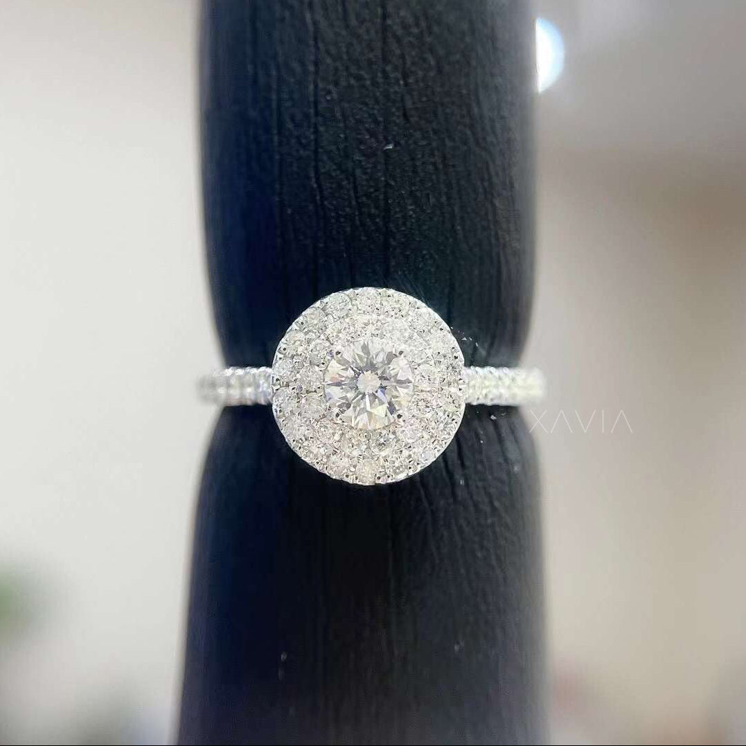 Top view of round cut lab diamond engagement ring with layered double halo and pavé diamonds surrounding the center stone