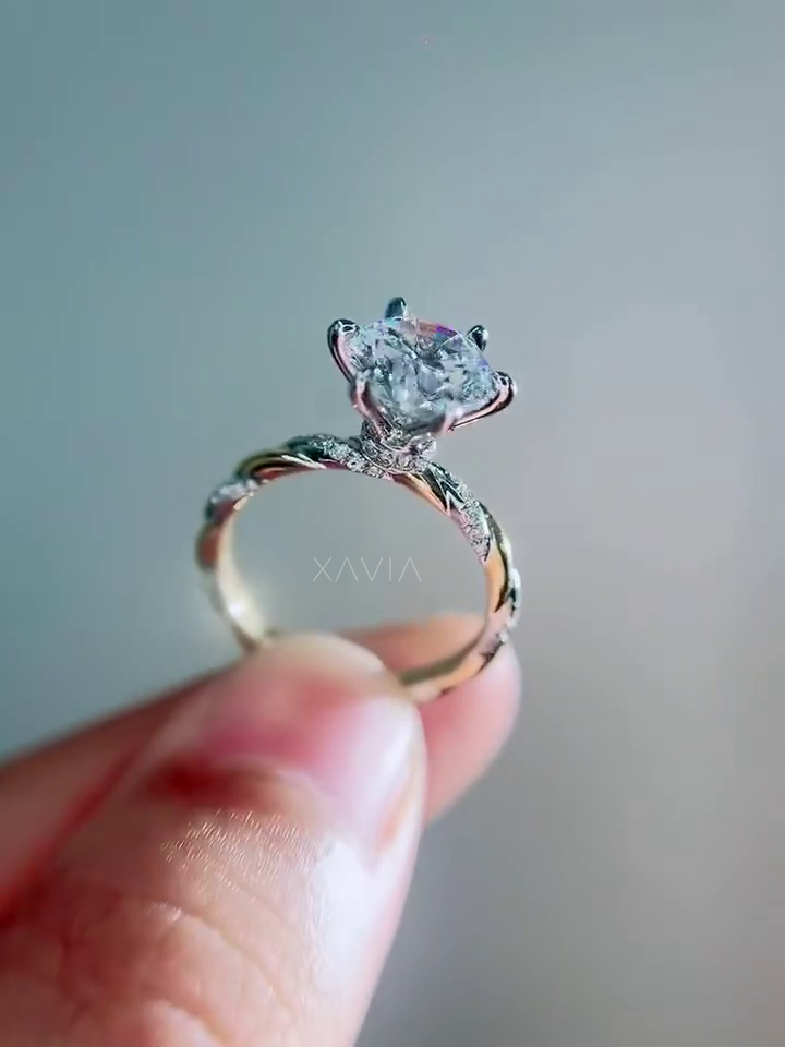 elegant lab grown round diamond engagement ring with cathedral solitaire mount and twisted pavé diamond band photographed against neutral background