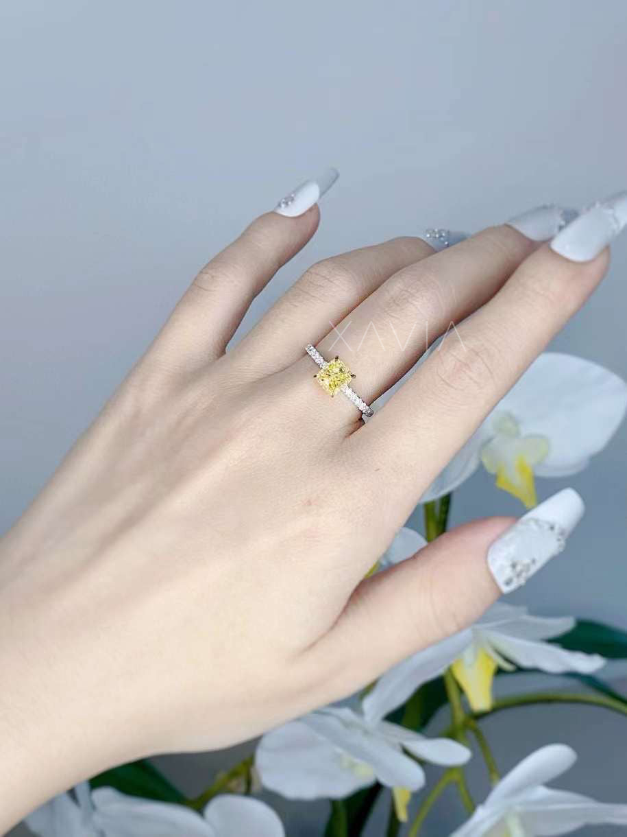 white and yellow lab diamond ring photographed with floral backdrop