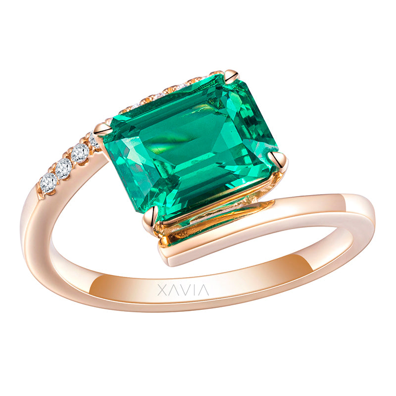 Front angled view of emerald cut lab grown diamond open band ring with pavé accent curve in polished yellow gold