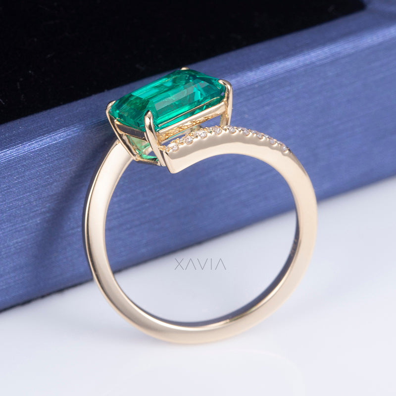 Back view of modern open band emerald cut lab diamond ring highlighting smooth polished gold comfort fit