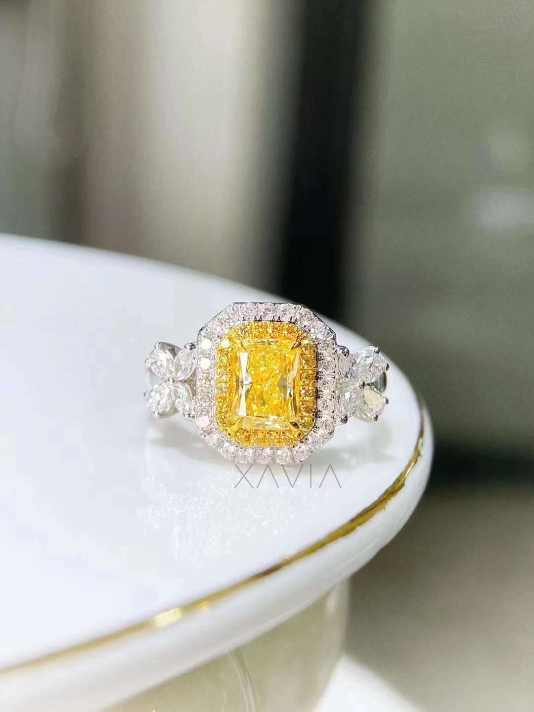 vivid yellow cushion cut diamond engagement ring with pavé halo and floral marquise pear side diamonds set in platinum