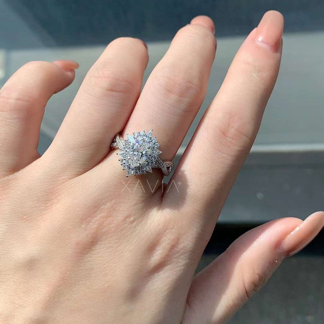 blooming floral lab diamond engagement ring worn on hand