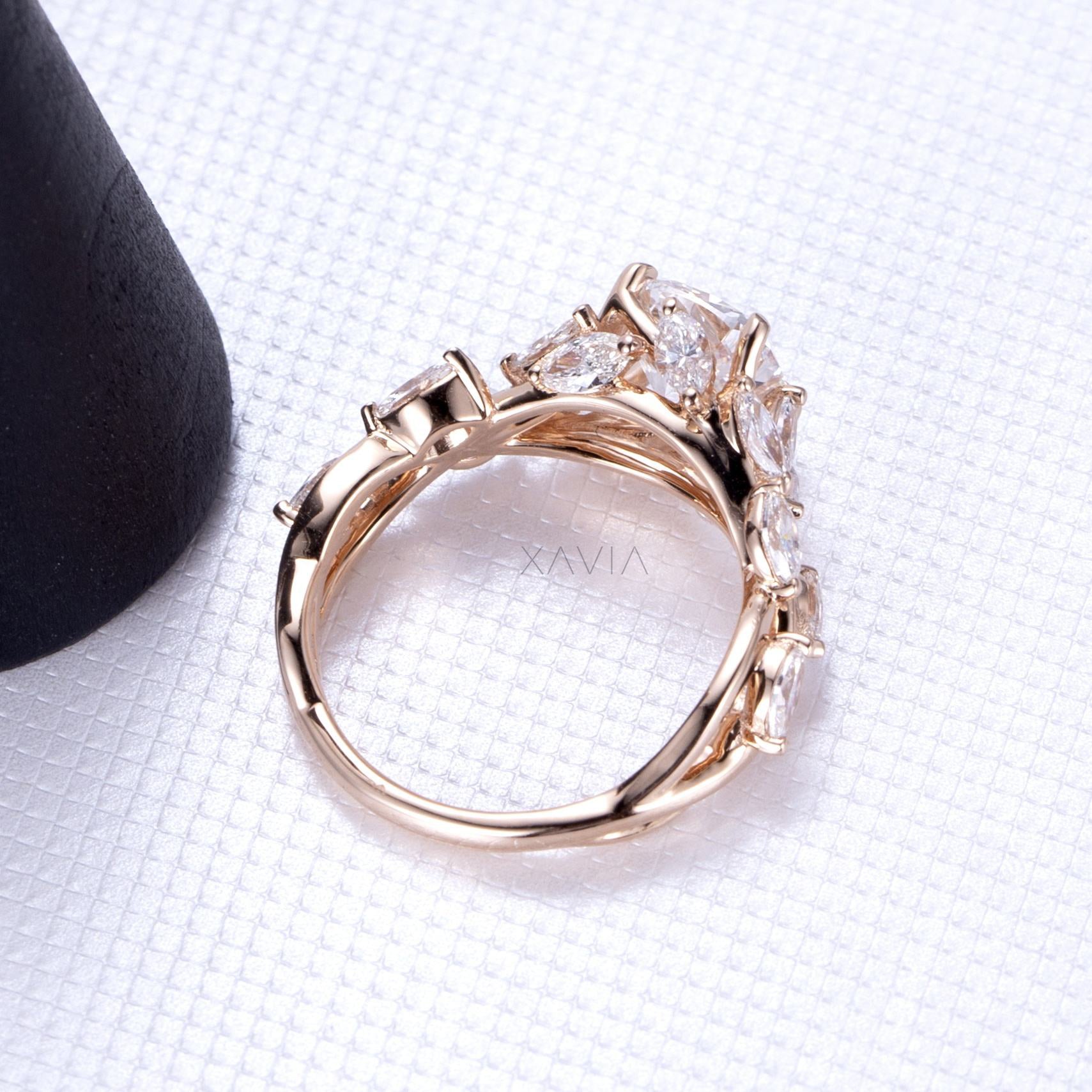 side profile of cushion cut lab diamond ring displaying marquise and baguette leaf shaped diamond cluster band in high polish rose gold setting