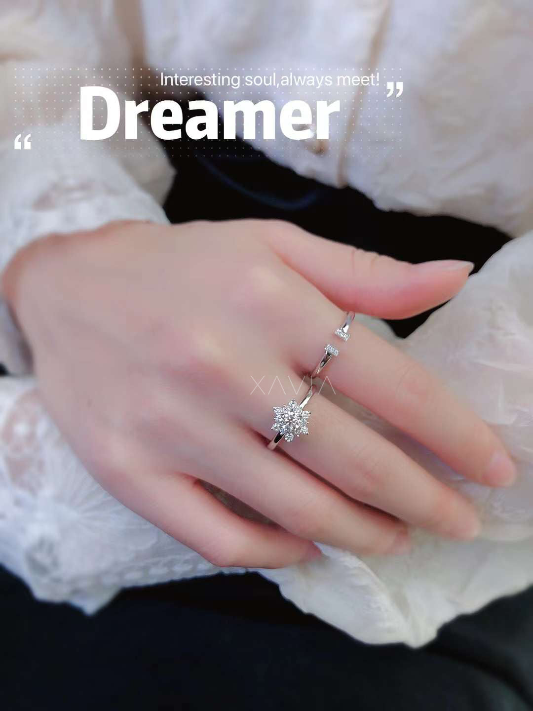 round brilliant lab grown diamond floral halo cluster ring worn on a woman's hand showing delicate minimalist band and starburst diamond flower design