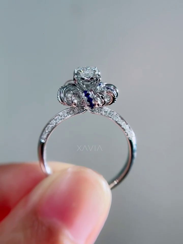 Rear gallery view of floral halo lab diamond ring showing curved petal structure and sapphire accents beneath round diamond center