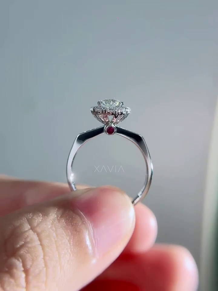 Top view of floral halo engagement ring with round brilliant lab grown diamond center surrounded by sparkling accent diamonds