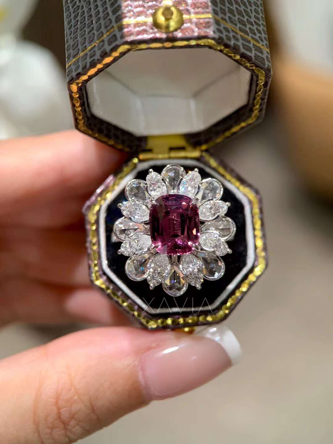 High brilliance floral cluster halo ring featuring vivid pink cushion center stone framed by pear shaped lab grown diamonds forming elegant petal halo