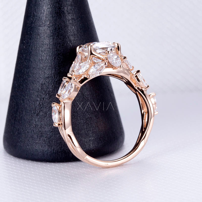 angled perspective of cushion cut diamond engagement ring showing detailed marquise leaf diamonds and baguette accents along sculpted band