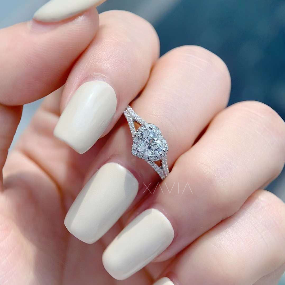 front view of lab diamond heart engagement ring on finger