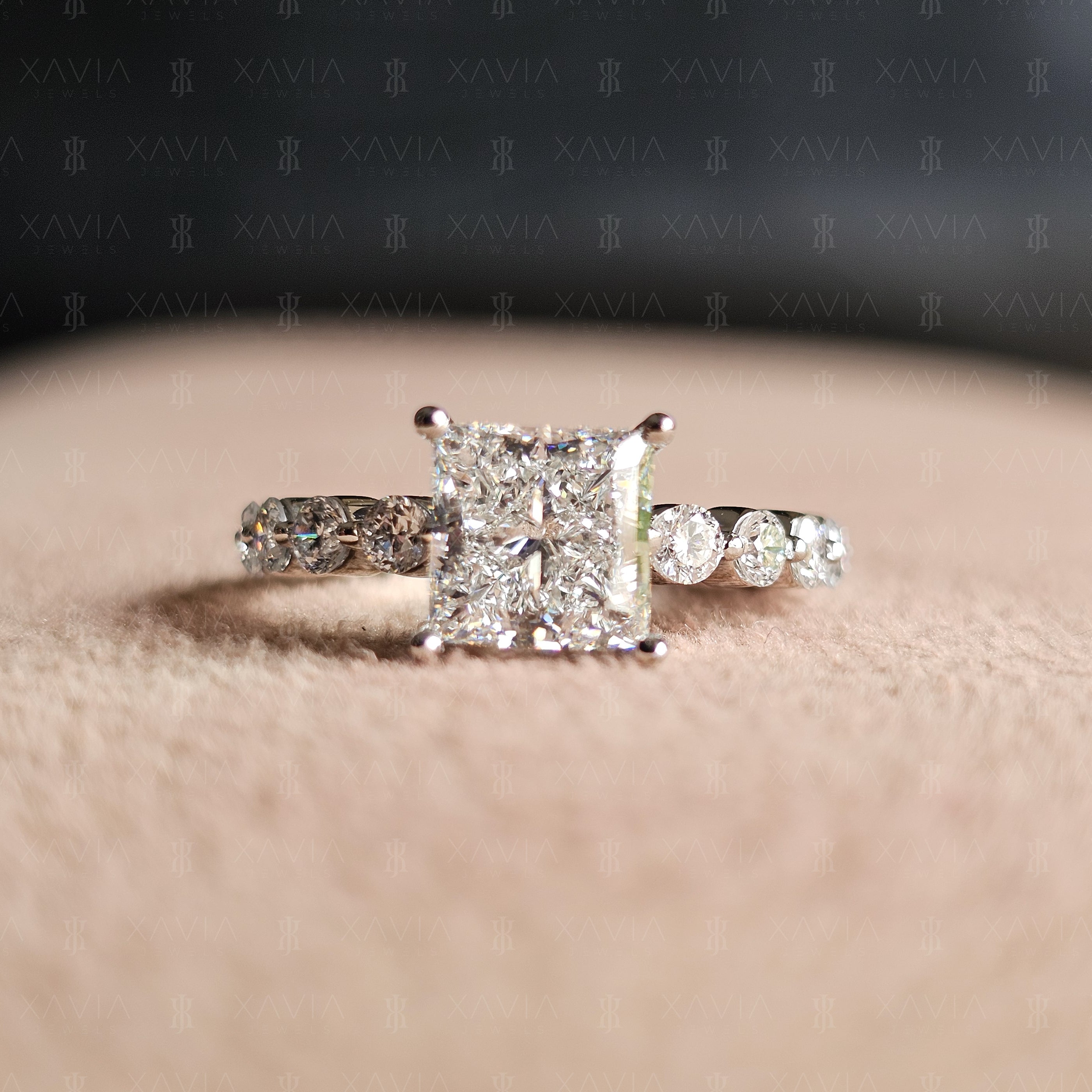 Front-facing view of princess cut lab diamond engagement ring with symmetrical four-prong setting and sparkling eternity-style round diamond band
