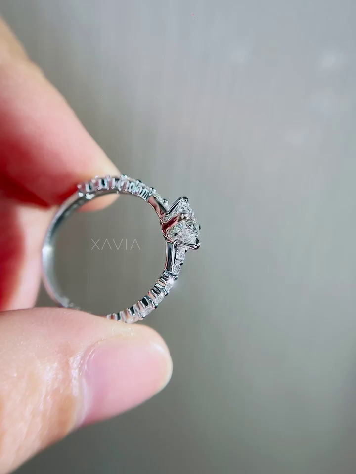 Full band profile of round cut lab diamond engagement ring showing pavé set upper shank, smooth comfort fit inner band and polished white metal finish