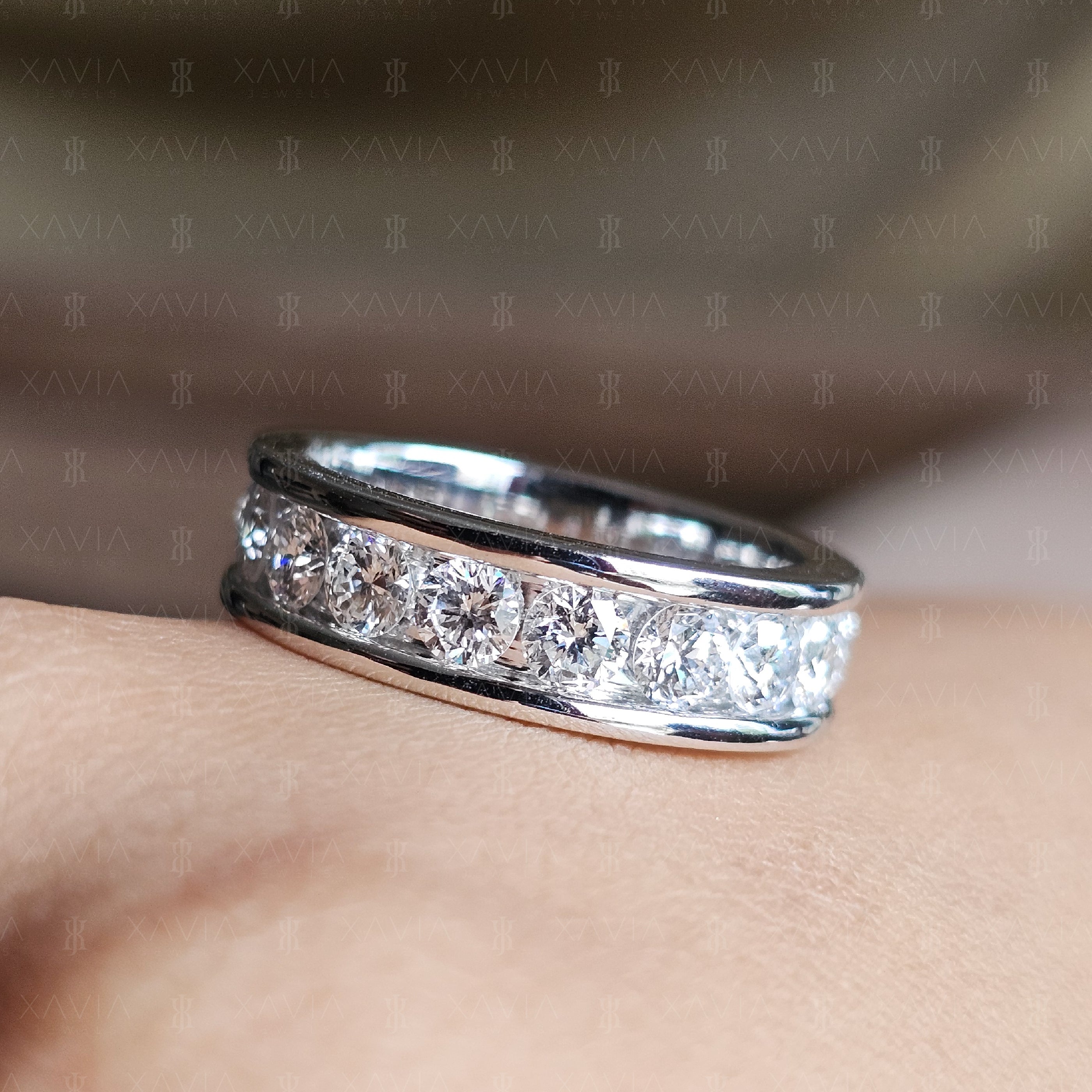 Macro photograph of full eternity lab-grown diamond wedding band showcasing continuous round stones and high-polish white metal finish