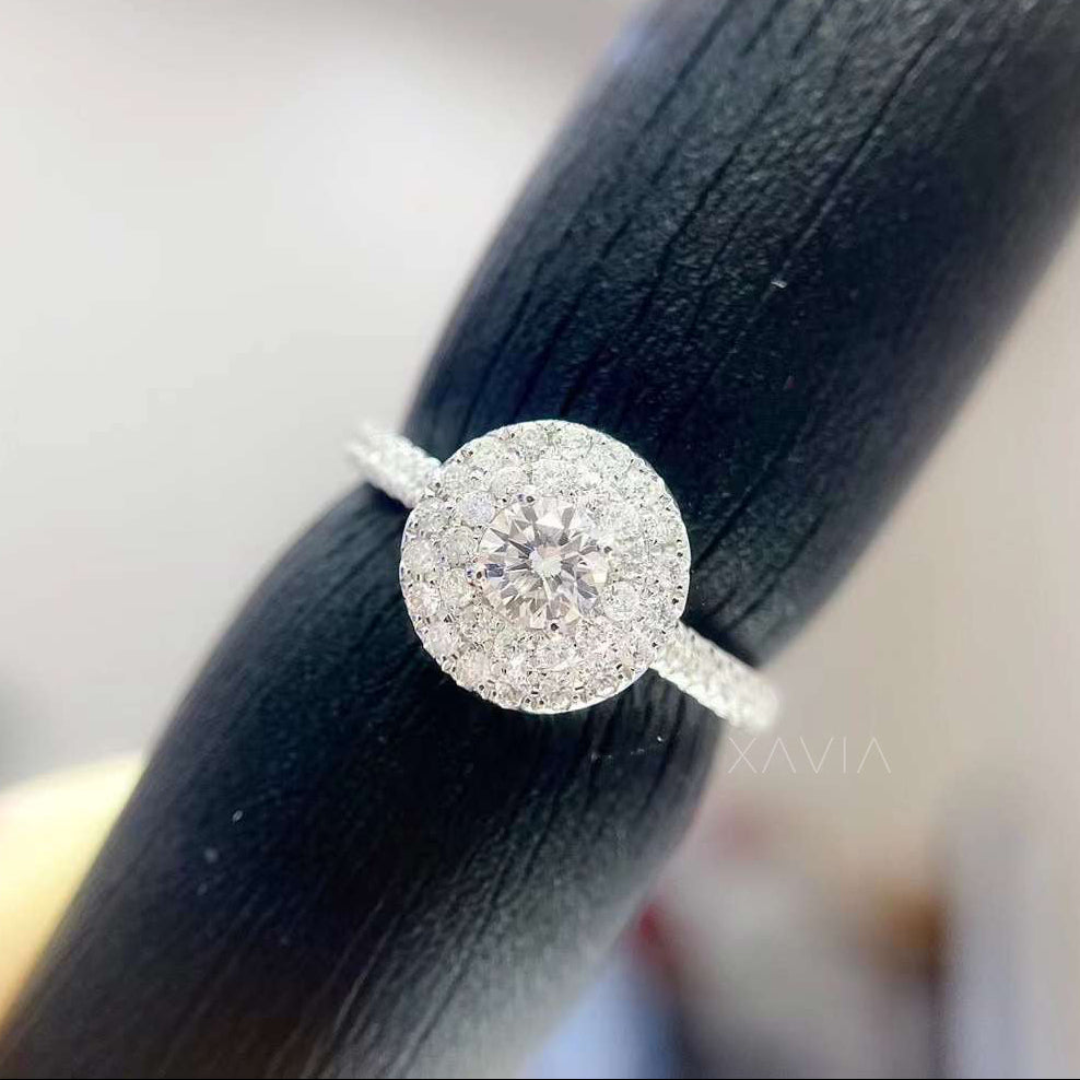 Angled view of round brilliant lab grown diamond halo ring showcasing multi-row pavé halo and refined white gold craftsmanship
