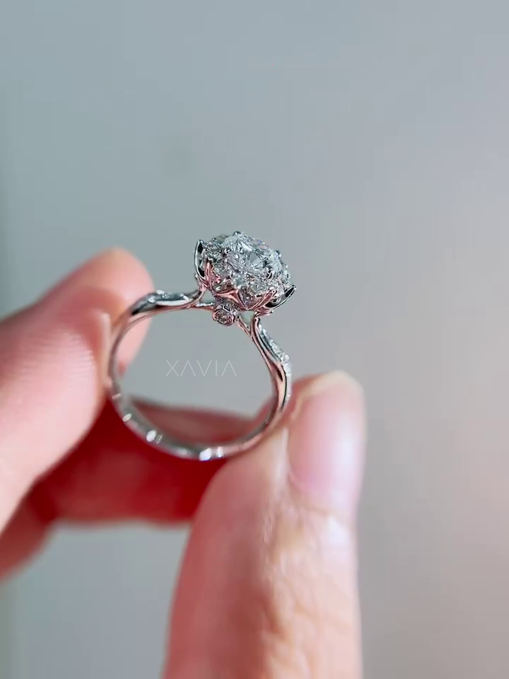 Side profile of round halo diamond engagement ring revealing cathedral band structure and elevated diamond halo setting