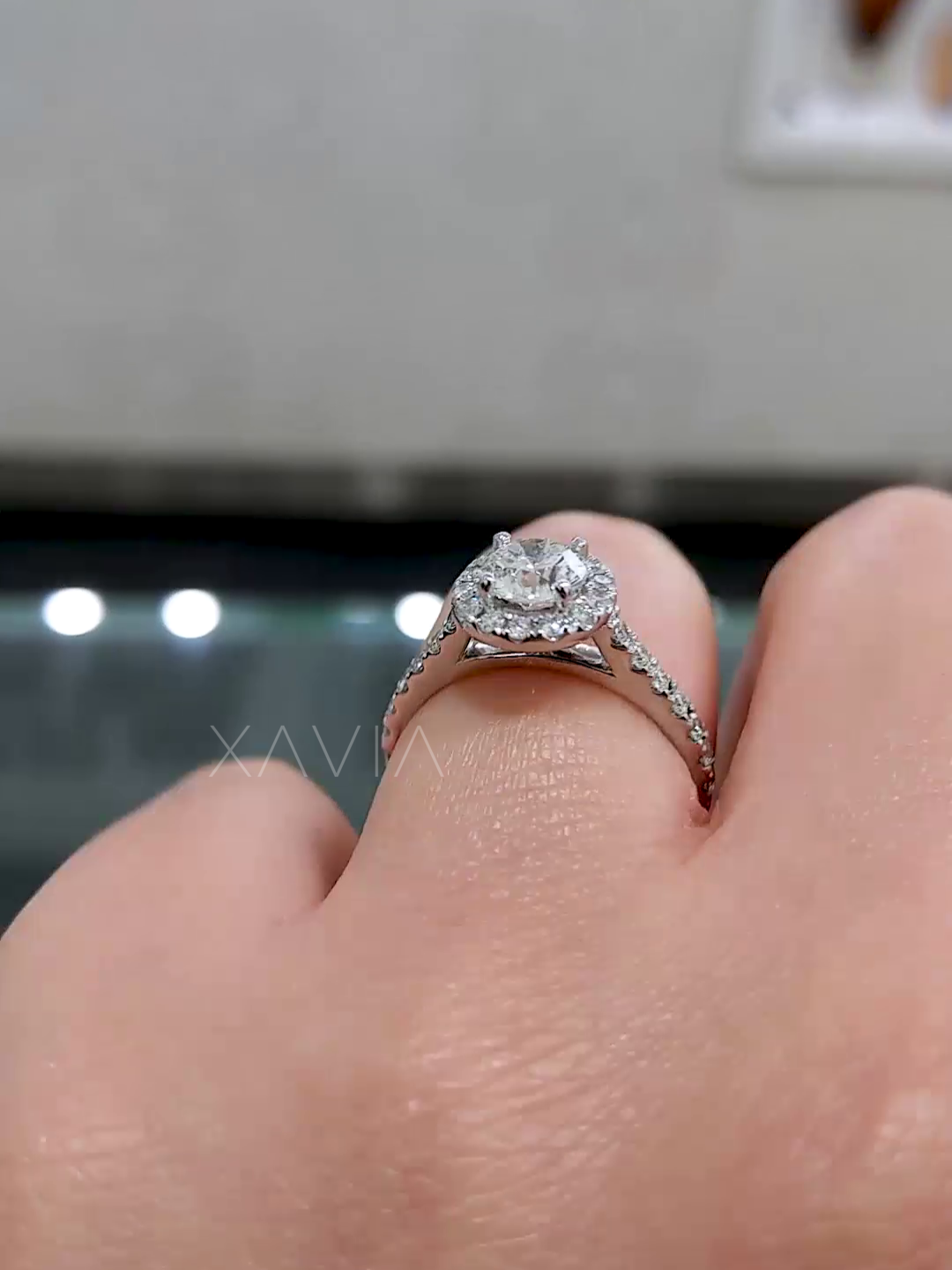 side view highlighting pavé diamonds and raised halo
