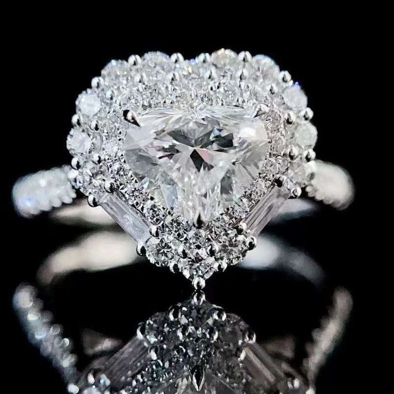 Front view of heart cut halo engagement ring showing brilliant lab diamond center surrounded by halo diamonds and pavé split shank band