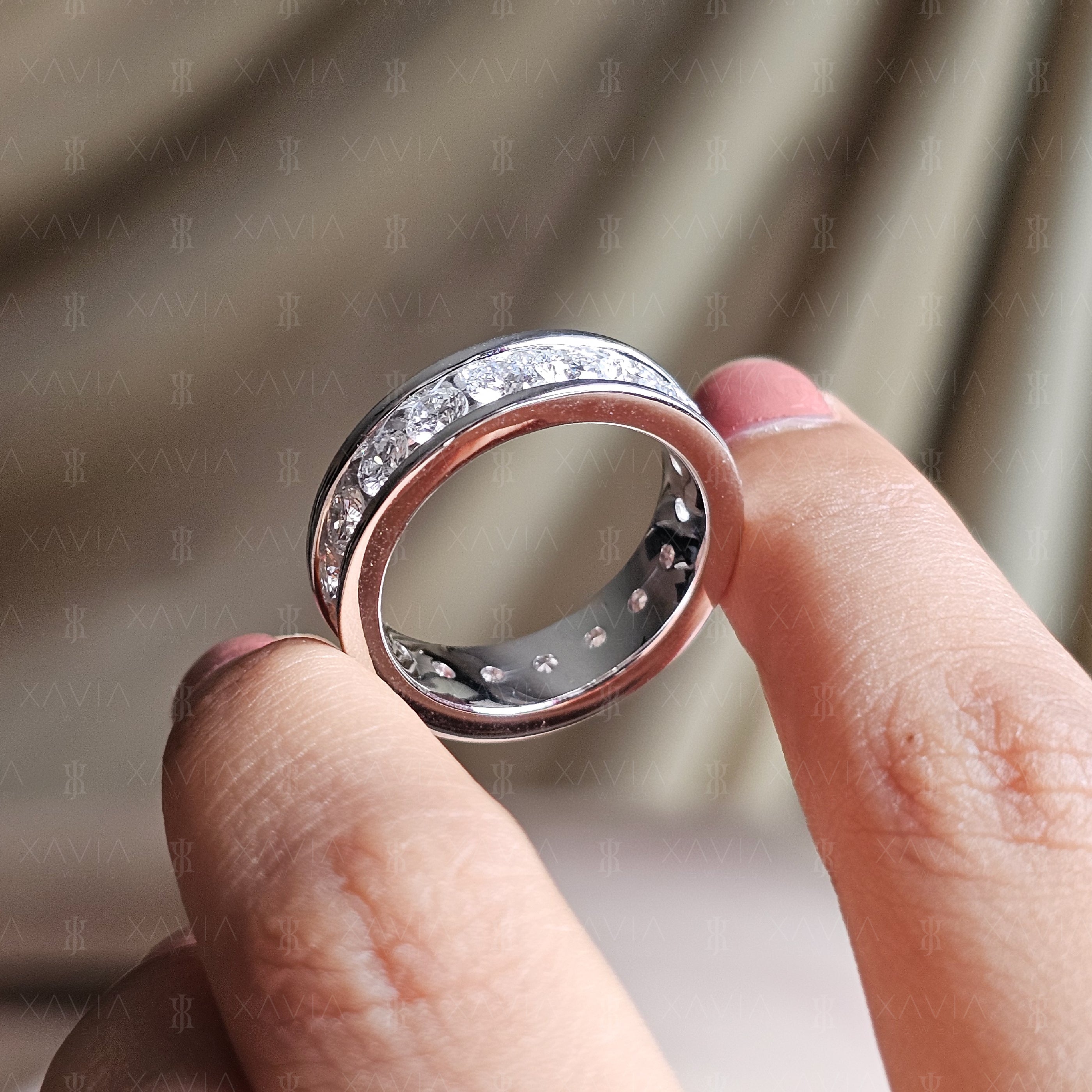 Interior comfort-fit view of polished eternity diamond ring with open gallery detailing and continuous channel-set round diamonds