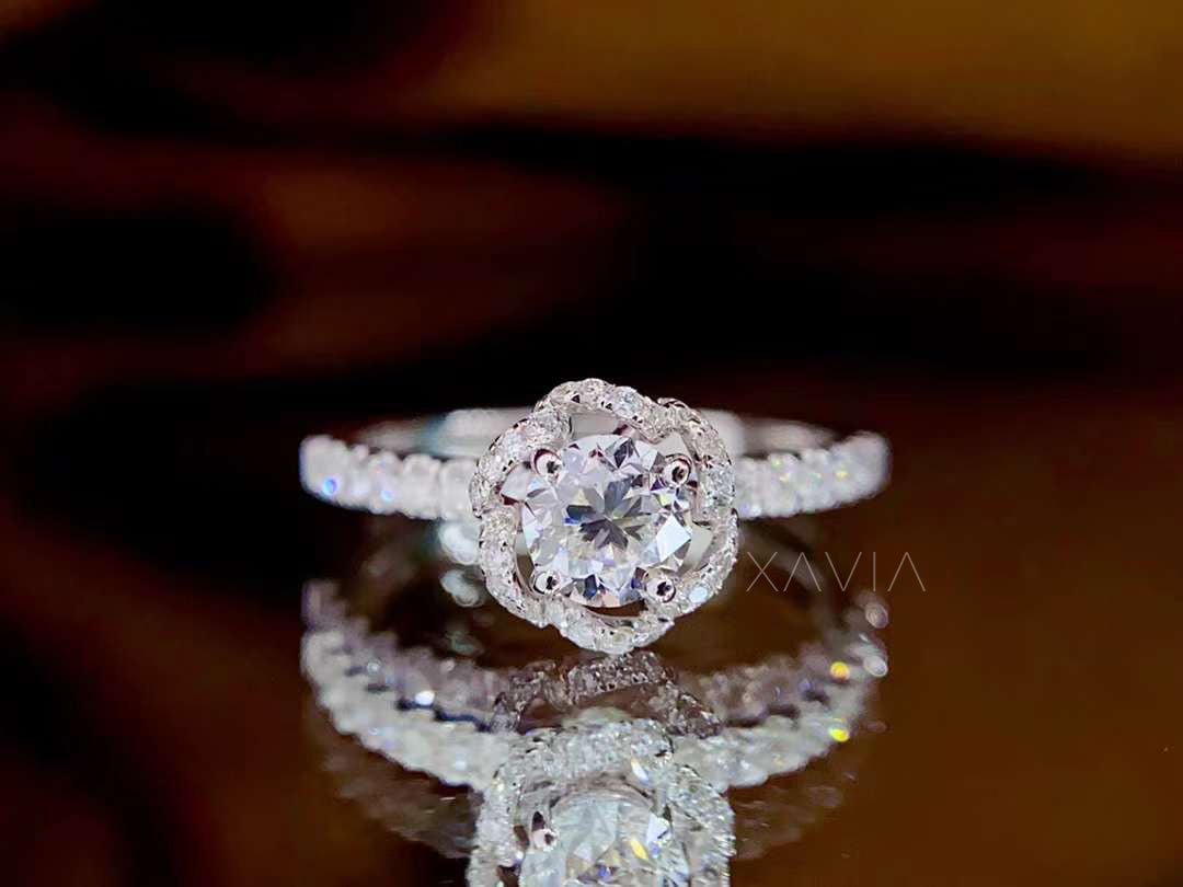 luxury floral halo round diamond engagement ring in platinum with pavé diamonds across band