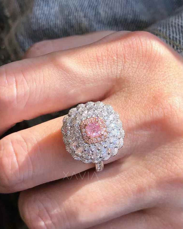 pink princess cut lab grown diamond floral halo cocktail ring worn on hand showing large diamond cluster halo sparkle and elegant setting
