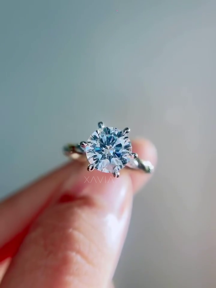 detailed top view of round brilliant lab grown diamond solitaire engagement ring with symmetrical six prong setting and sculpted twisted band